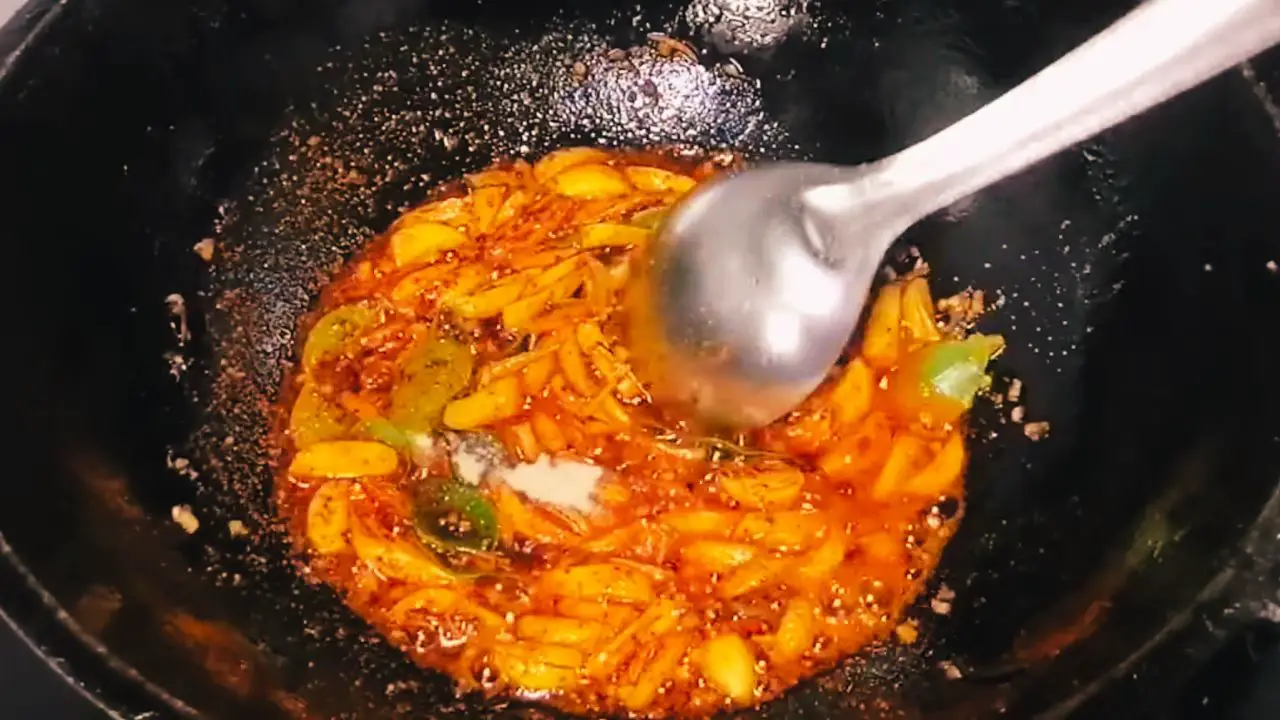 Adding asafetida and curry leaves 