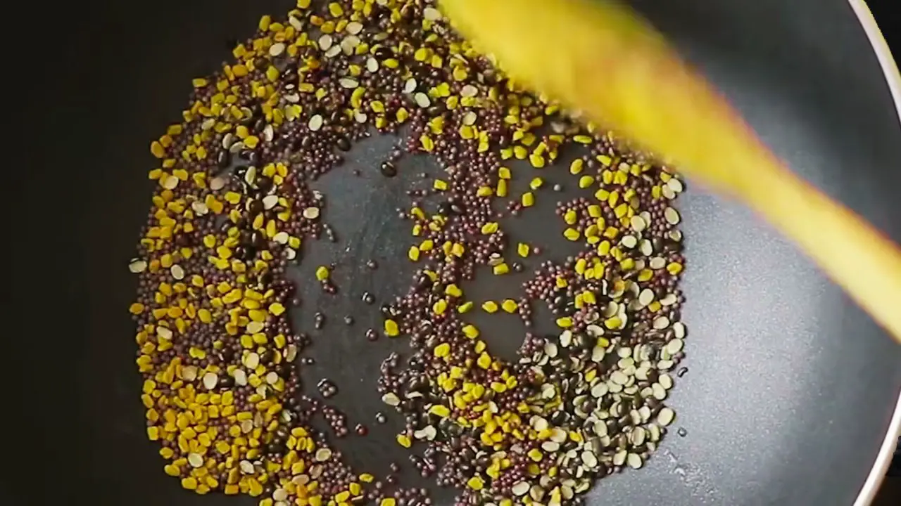 Roasting the spices for making Ginger Pickle