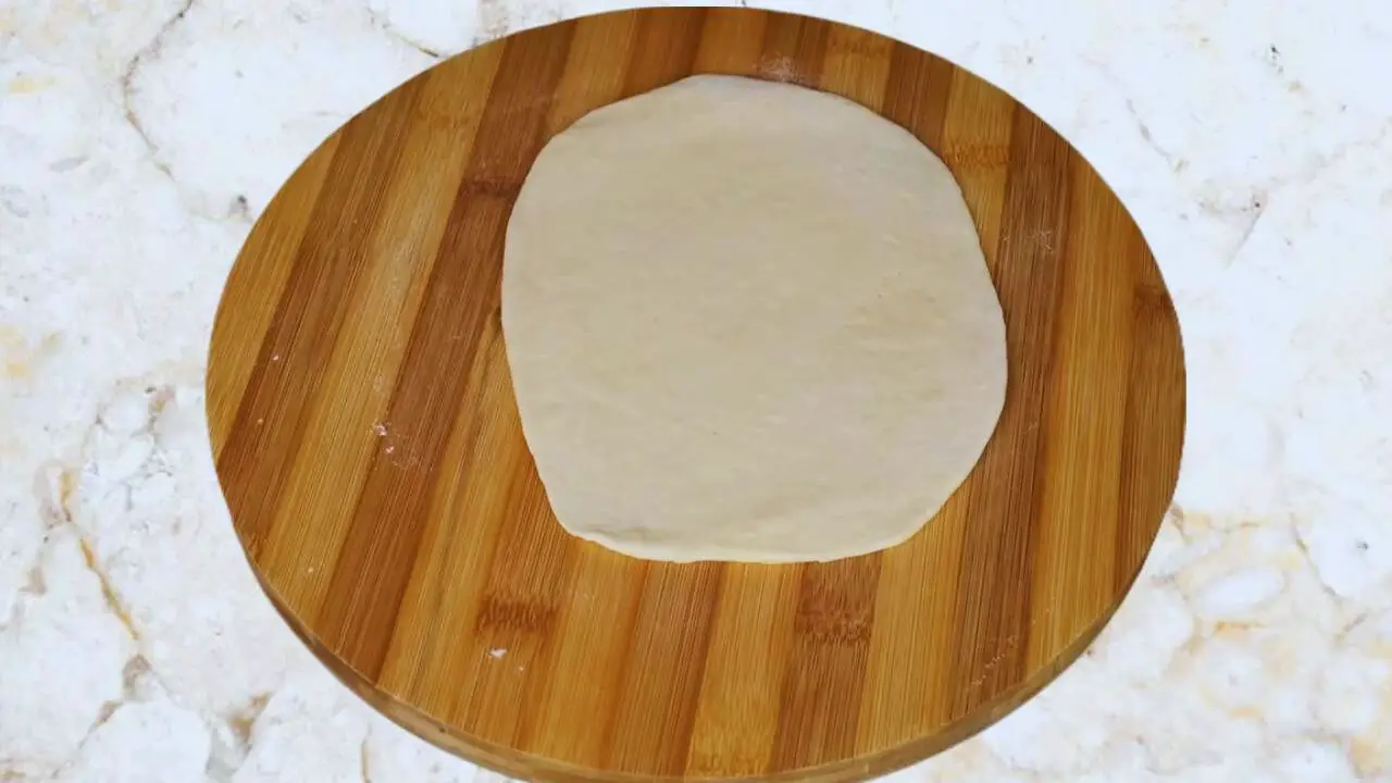 Rolling the paratha