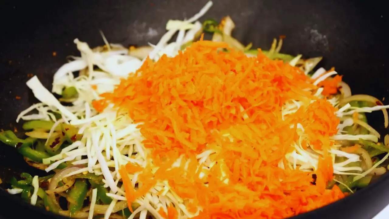 Adding carrots and cabbage 