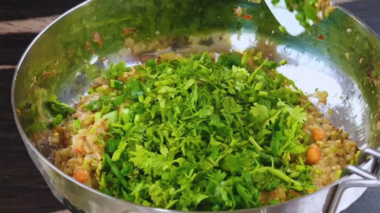 Adding coriander leaves 