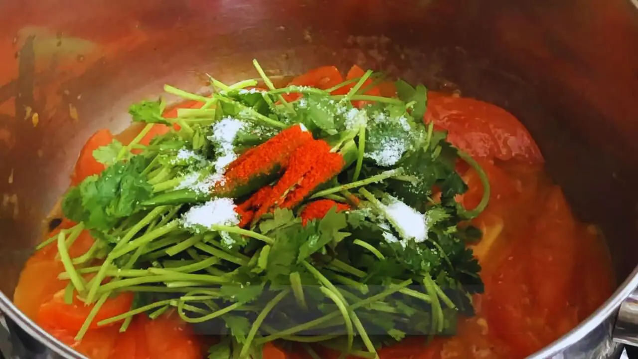 Tomato coriander soup recipe step 5 Adding coriander stems