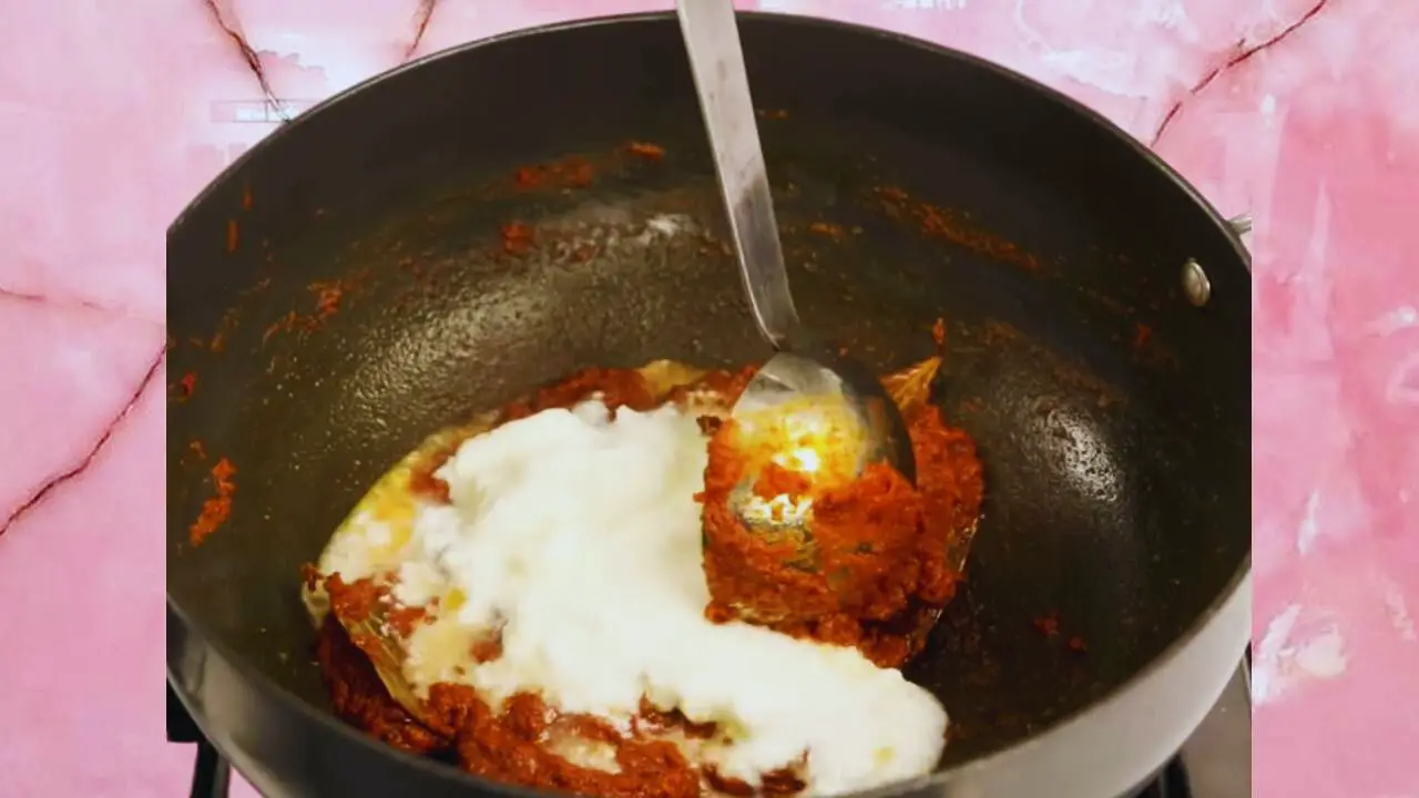 Adding curd to the masala 