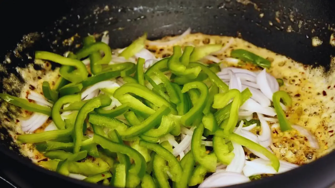 Adding onion and capsicum 