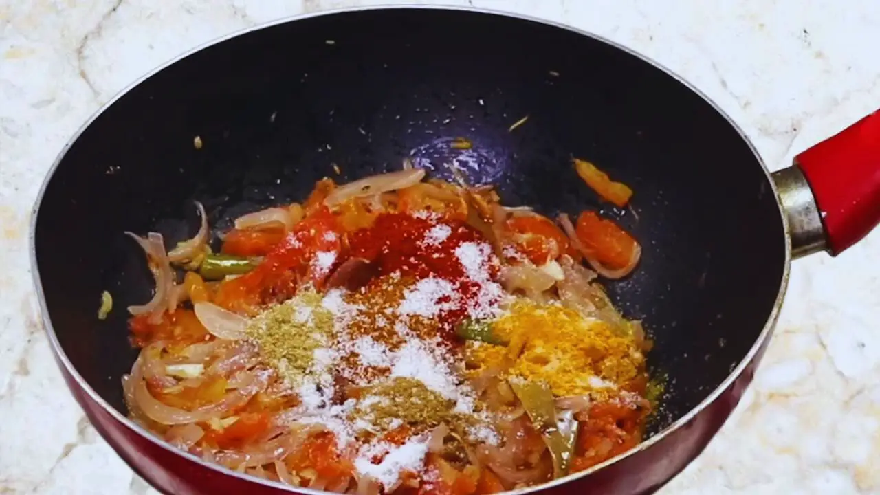 Aloo baingan curry recipe step 12 Adding powder spices