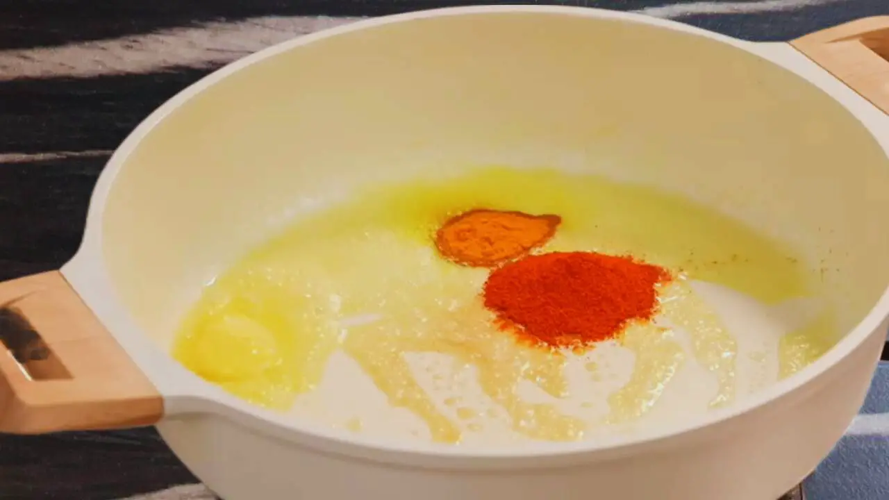 Adding turmeric and red chili powder 