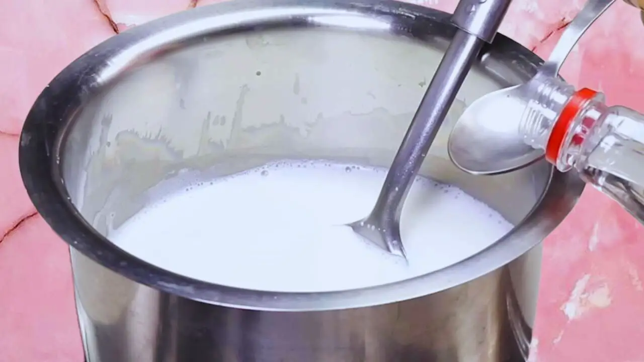 Rasmalai recipe step 1 Adding vinegar to boiling milk