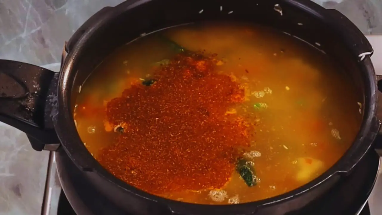 Adding water and powdered spices 