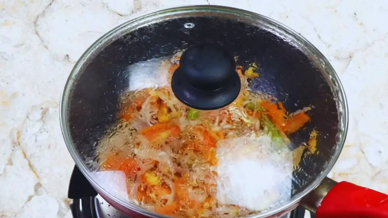 Aloo baingan curry recipe step 11 Cooking tomatoes