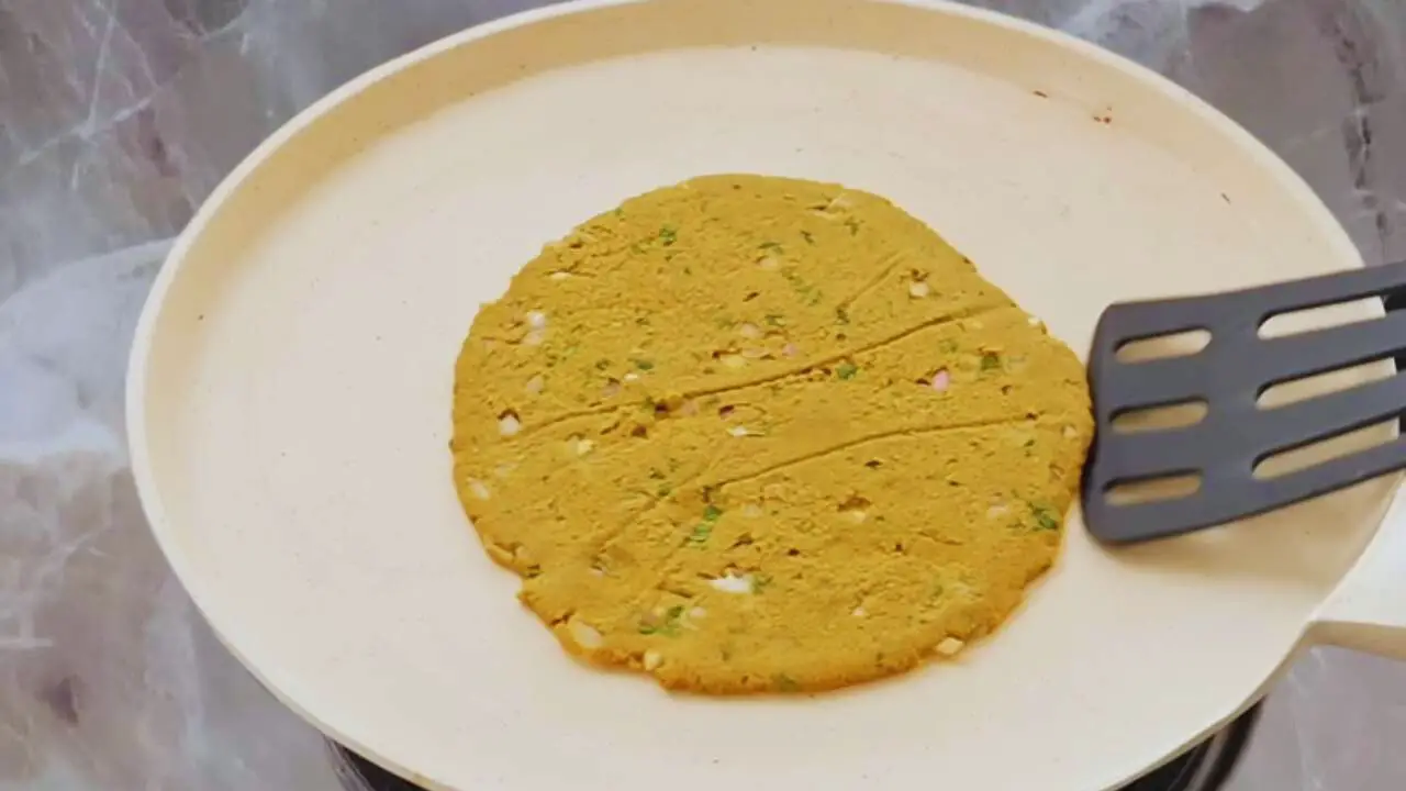 Flipping Bajra Masala Paratha 
