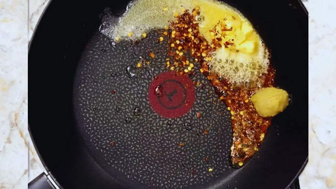 Frying chili flakes and ginger garlic paste 