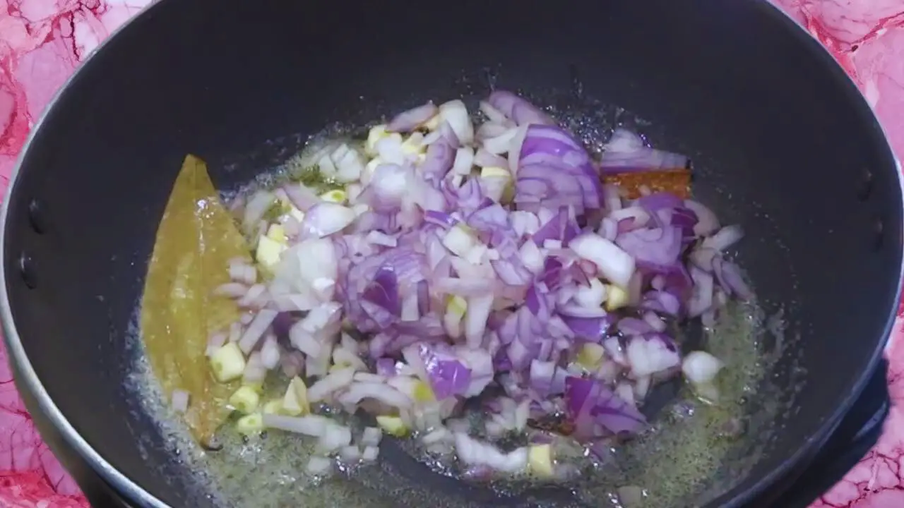Palak soup recipe step 2 Frying onion and garlic