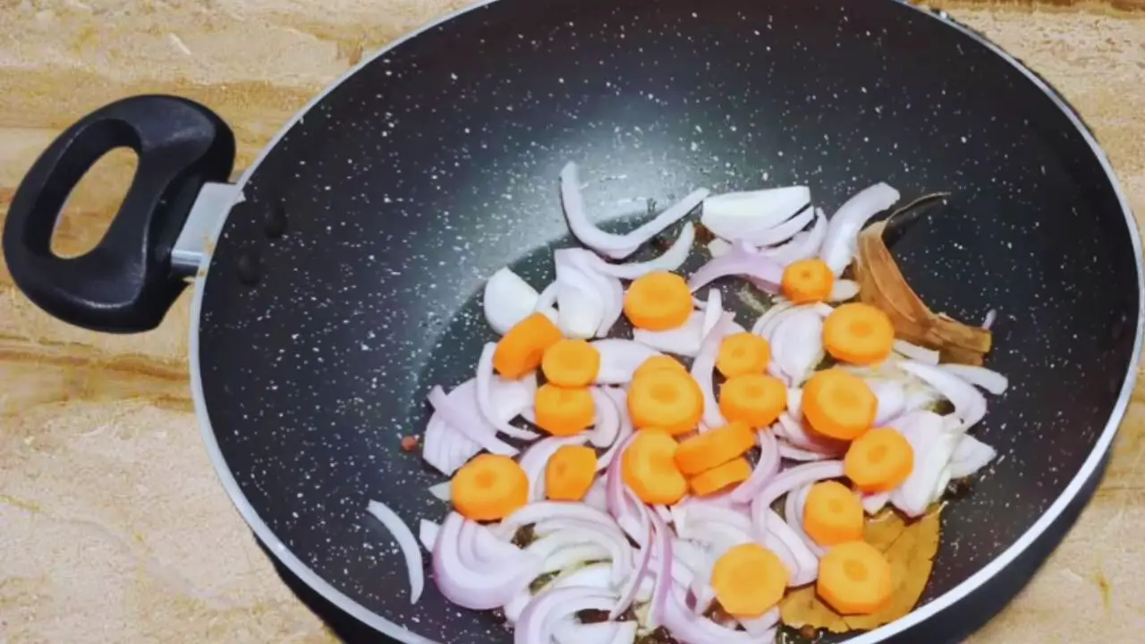 Frying onions and carrots 