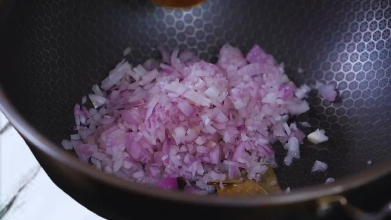Frying onions in spices 