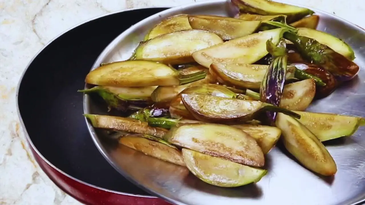 Aloo baingan curry recipe step 7 Keeping fried brinjals aside on a plate