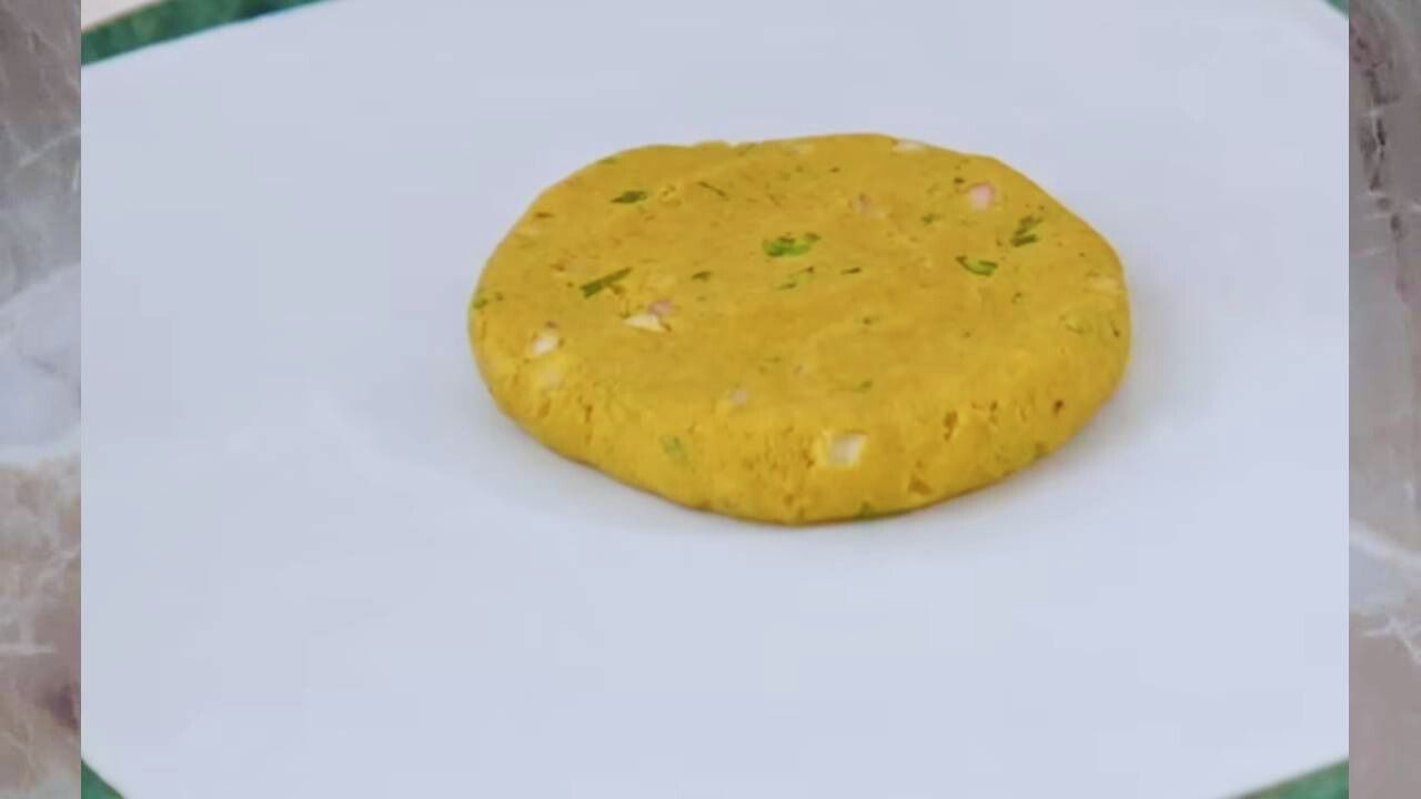 Placing bajra peda on butter paper