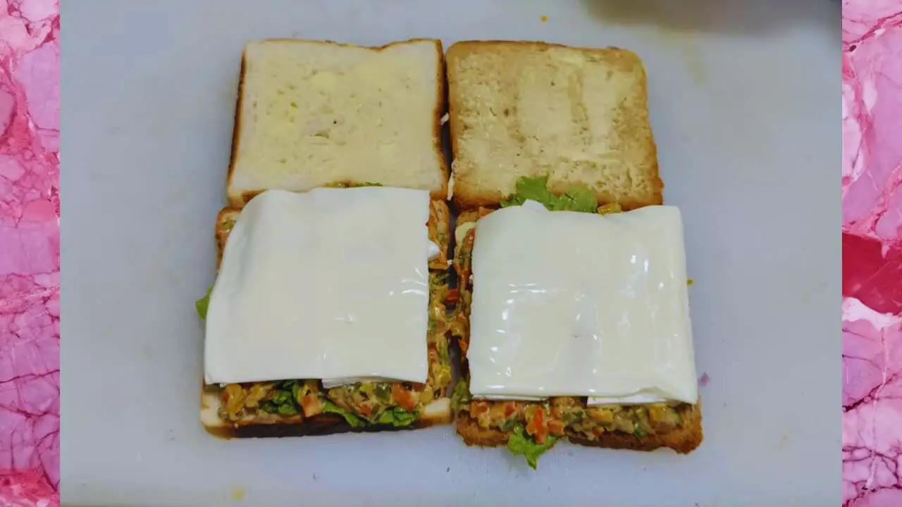 Putting cheese slices 