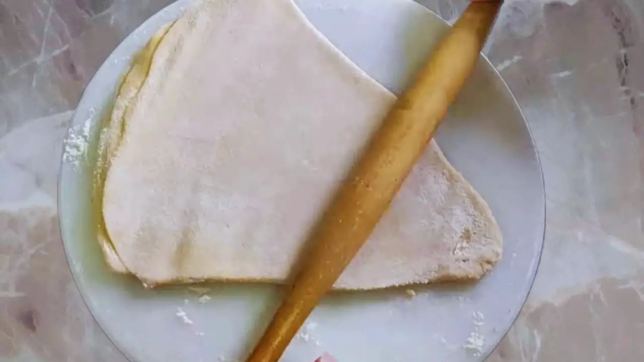 Rolling to shape like a paratha 