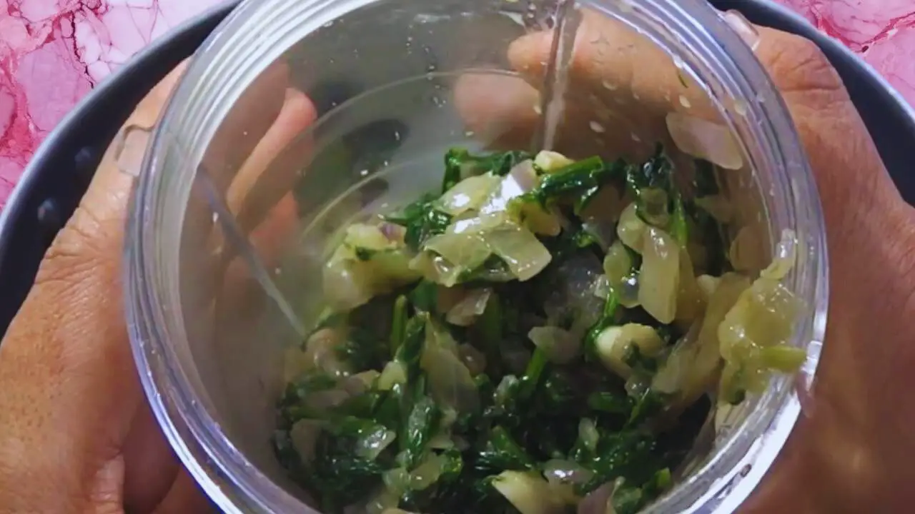 Palak soup recipe step 6 Transferring mixture to grinder
