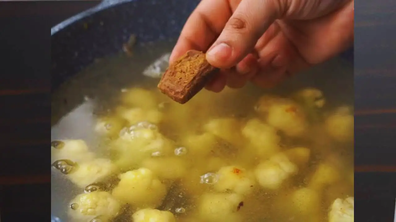 Adding chicken stock cube to cauliflower soup 