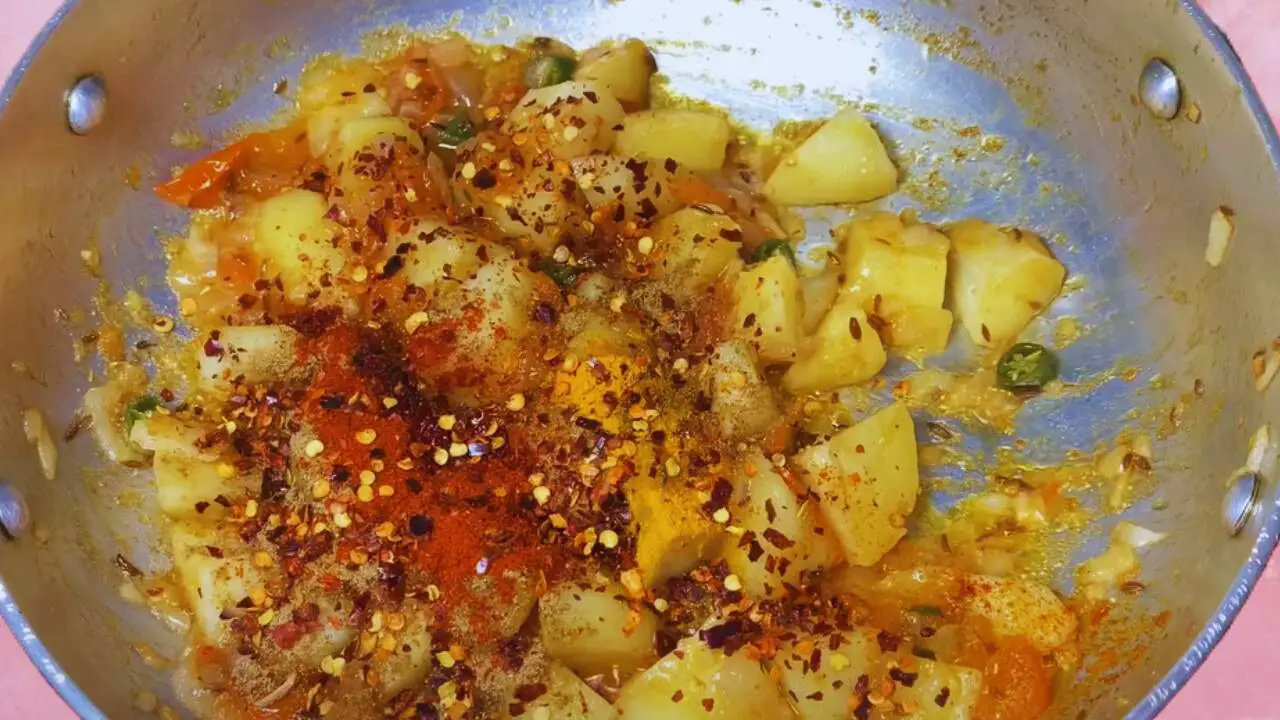 Aloo palak recipe step 6 Adding powdered spices