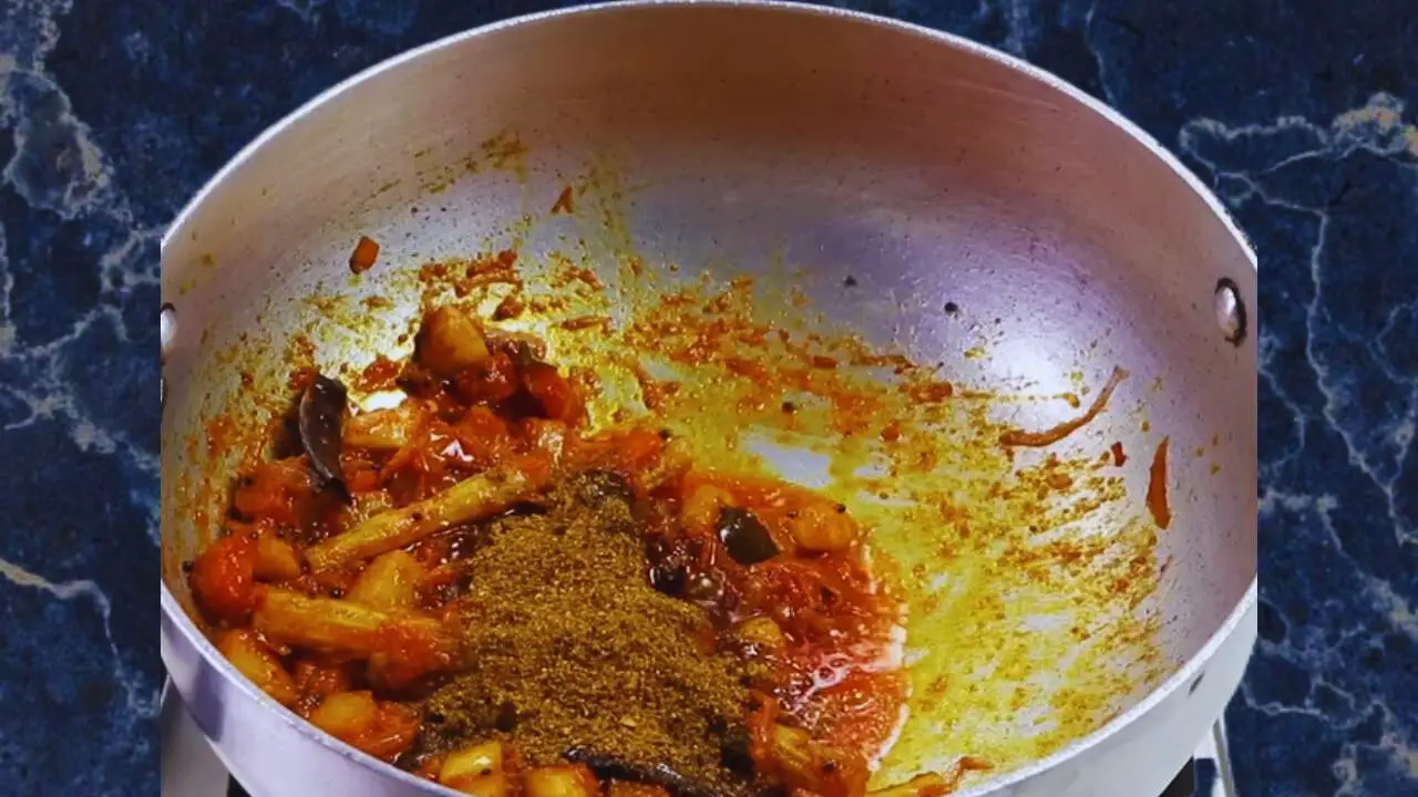 Adding sambar masala powder 