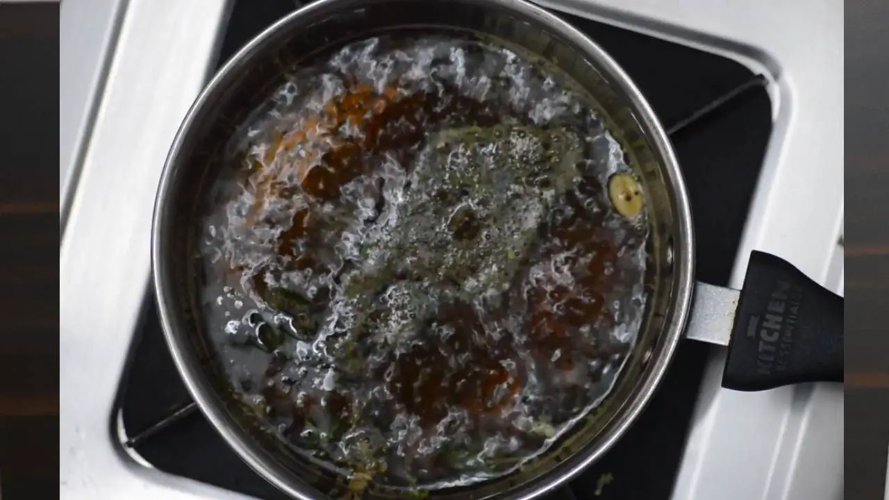 Tulsi tea recipe step 2 Adding tea leaves