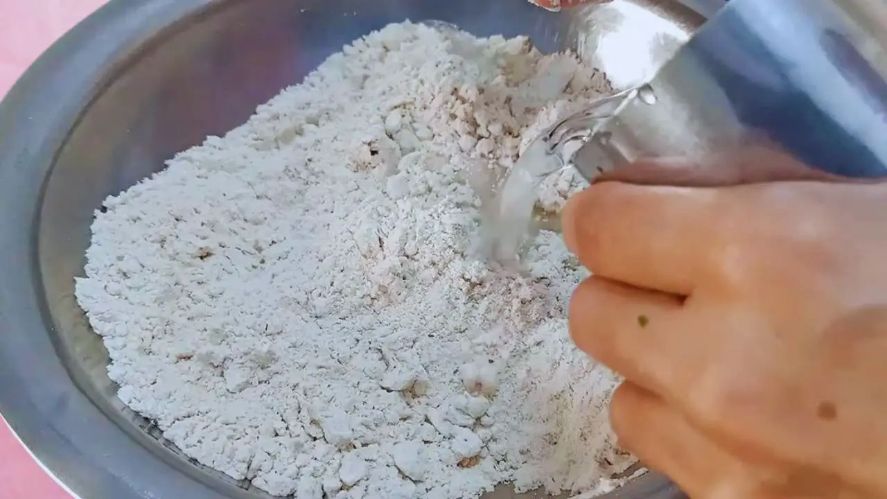 Paneer paratha recipe step 2 Adding water to make paneer paratha dough