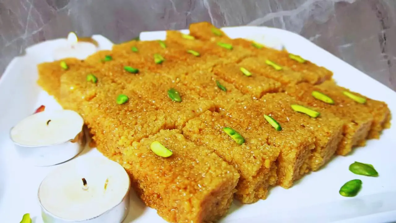 Milk Cake is garnished and served in small pieces 