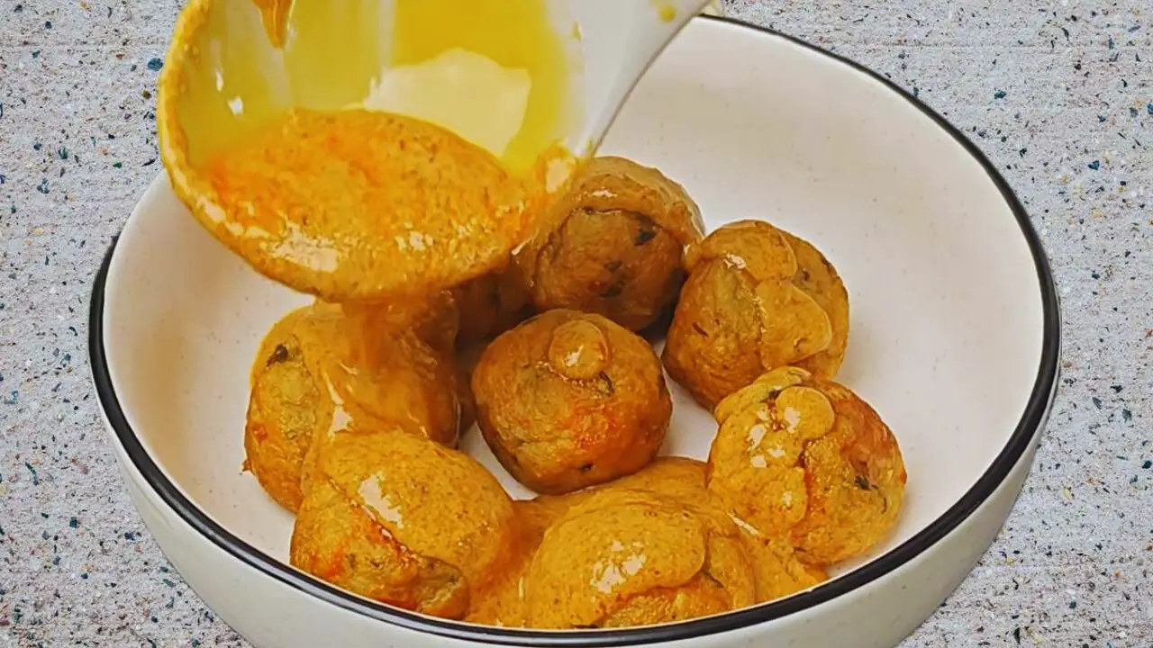 Vegetable kofta recipe step 13 Puring gravy on Vegetable Kofta balls