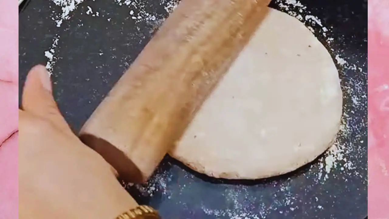 Paneer paratha recipe step 7 Rolling paneer paratha