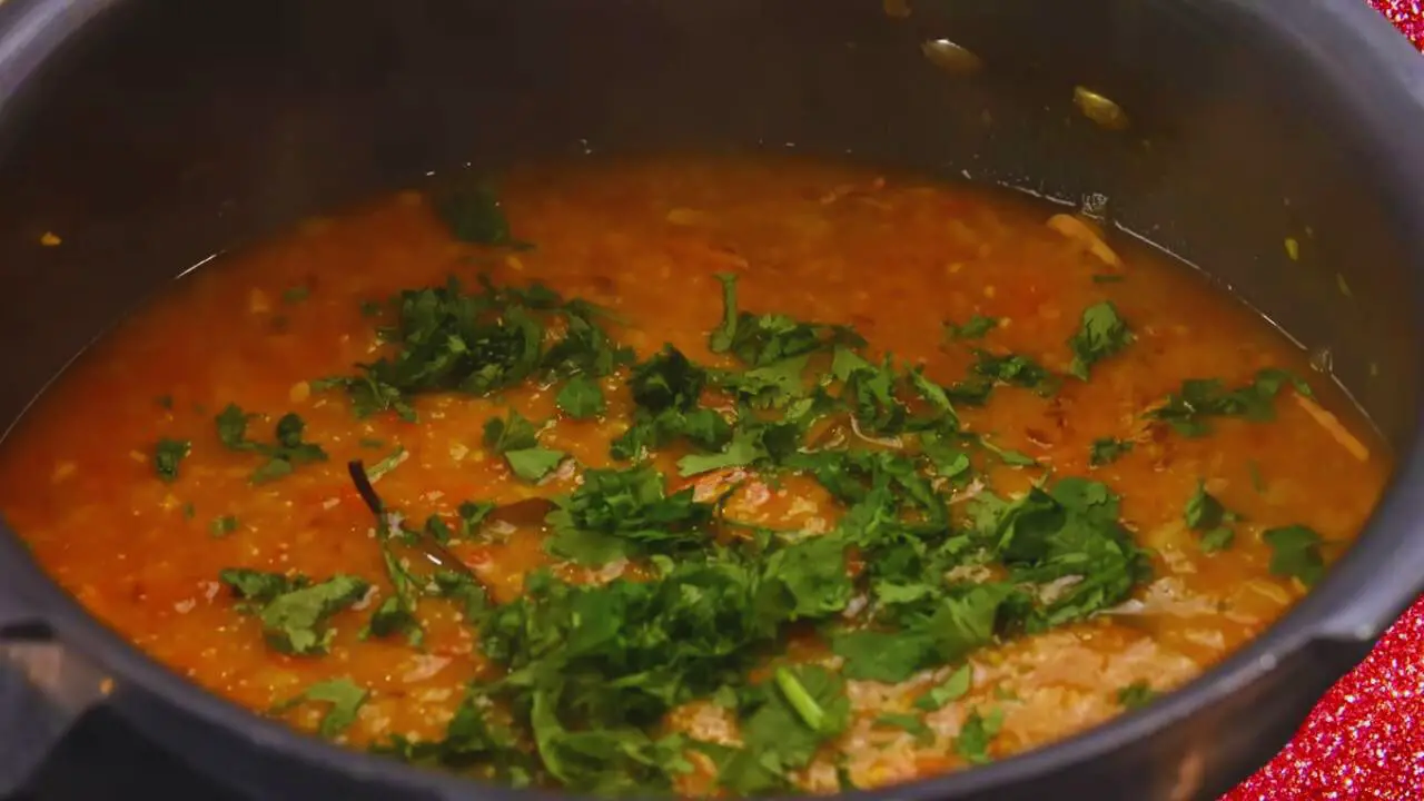 Adding coriander leaves 