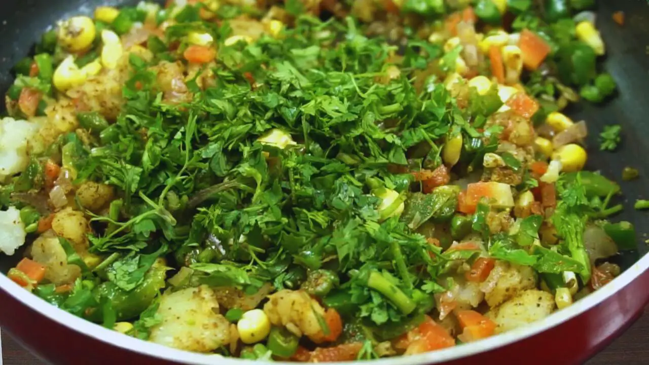Adding coriander leaves 