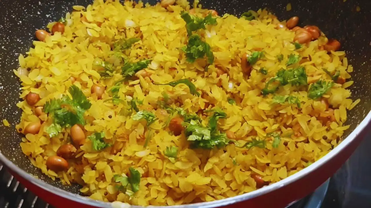 Poha recipe step 10 Adding coriander leaves
