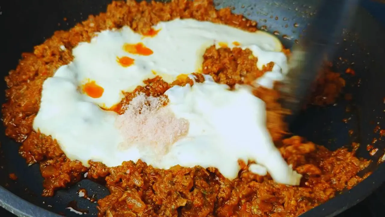 Egg tikka masala recipe step 7 Adding curd and salt