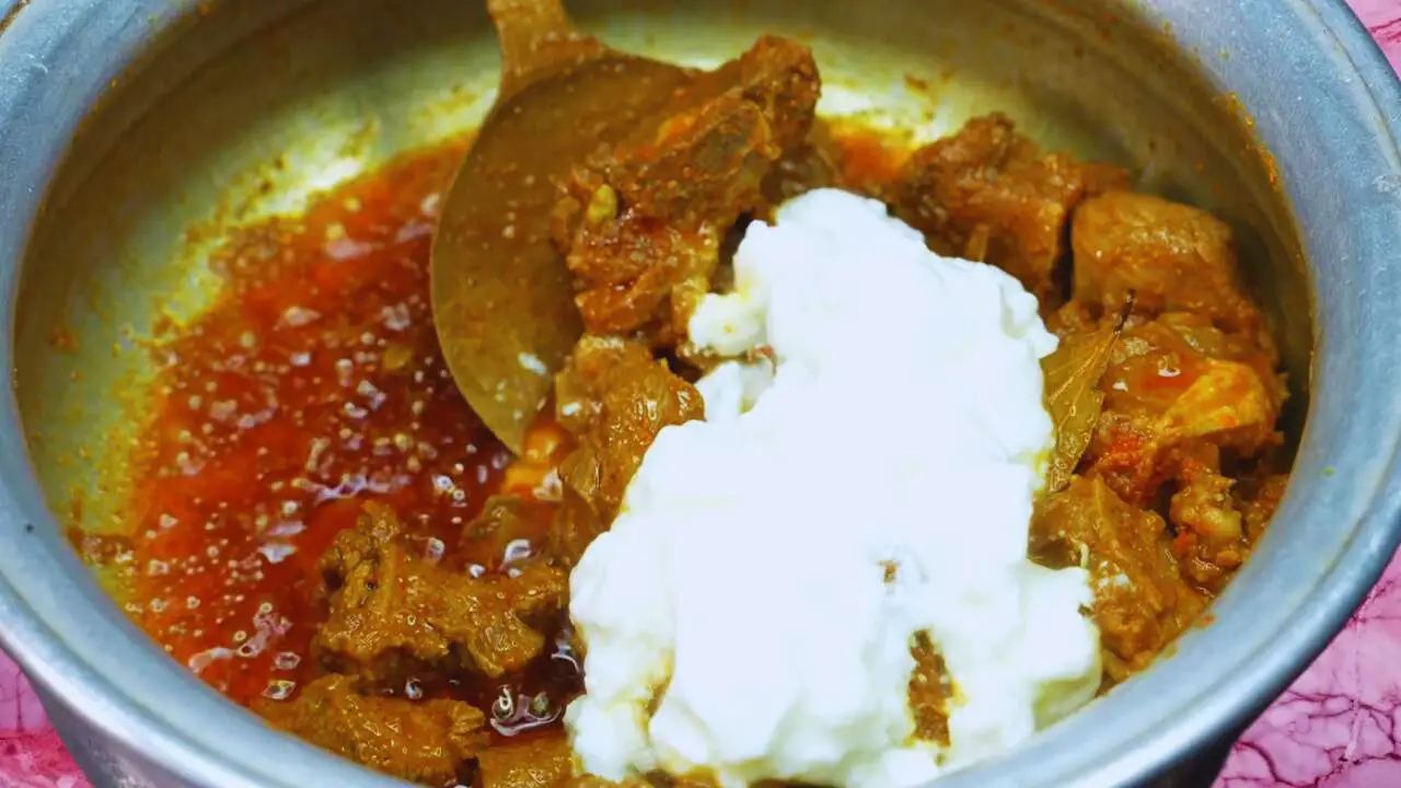 Mutton korma recipe step 7 Adding Dahi