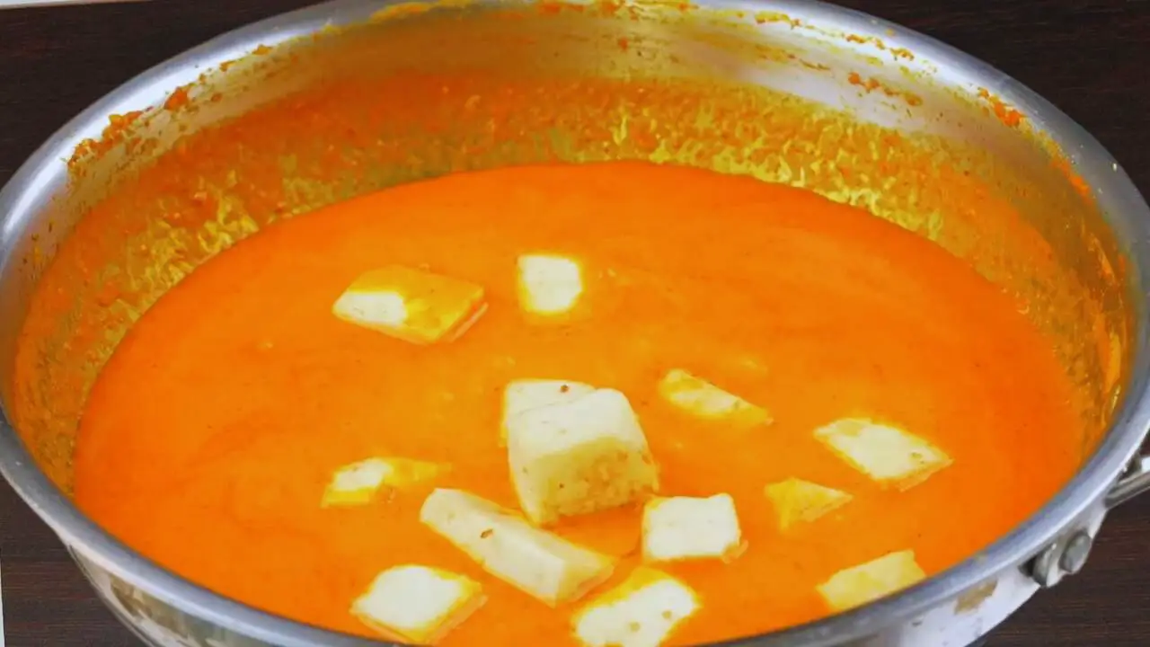 Adding fried paneer cubes 