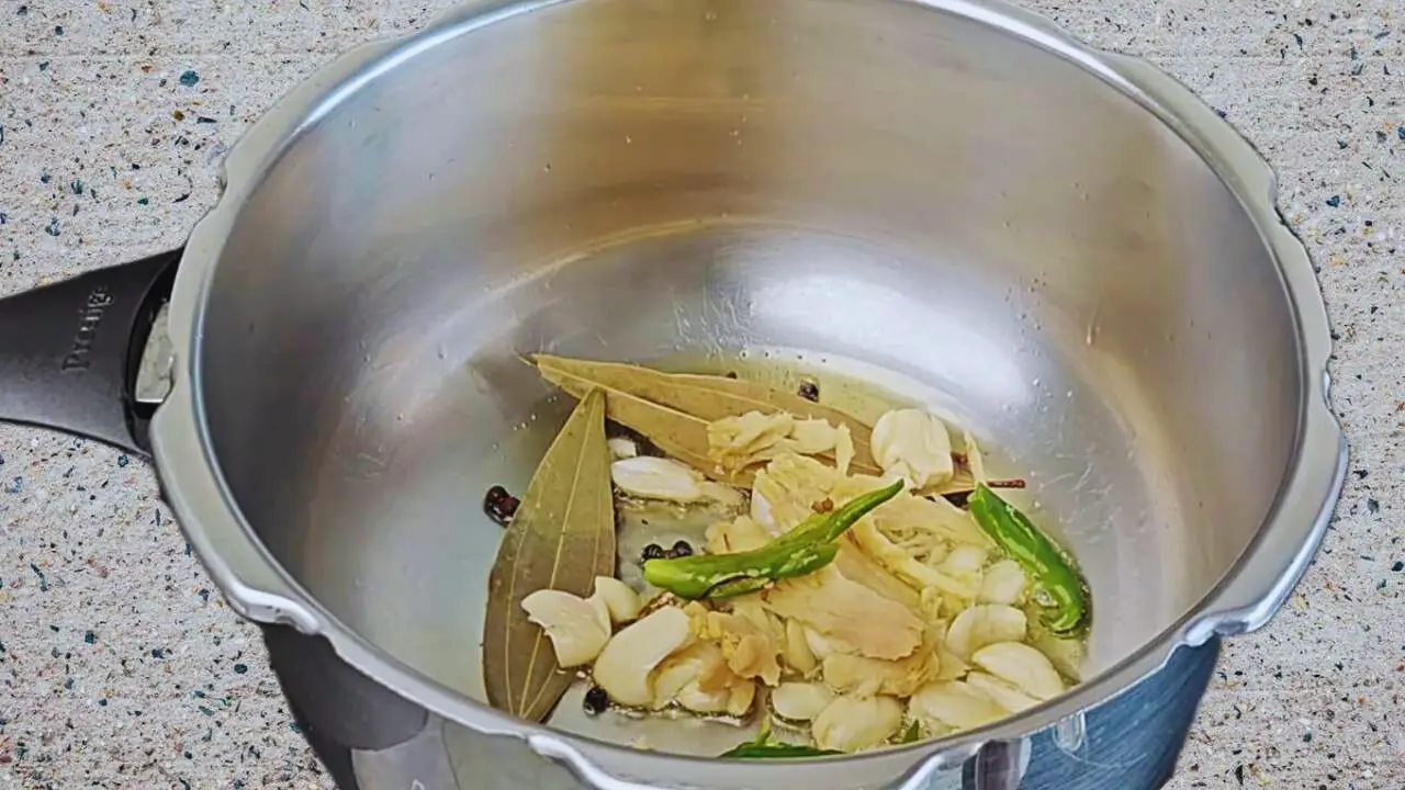 Adding ginger, garlic and chilies