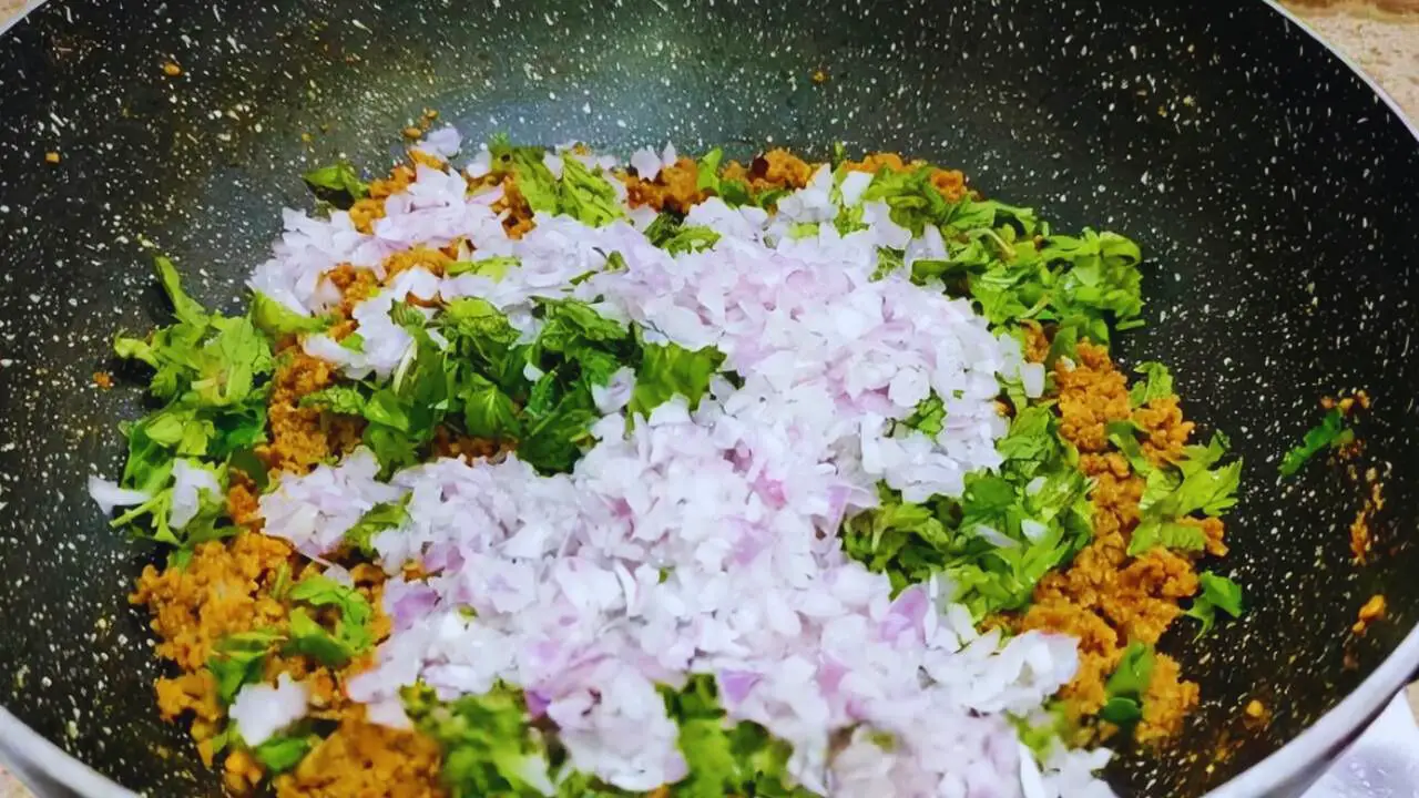 Adding onions, mint and coriander leaves 