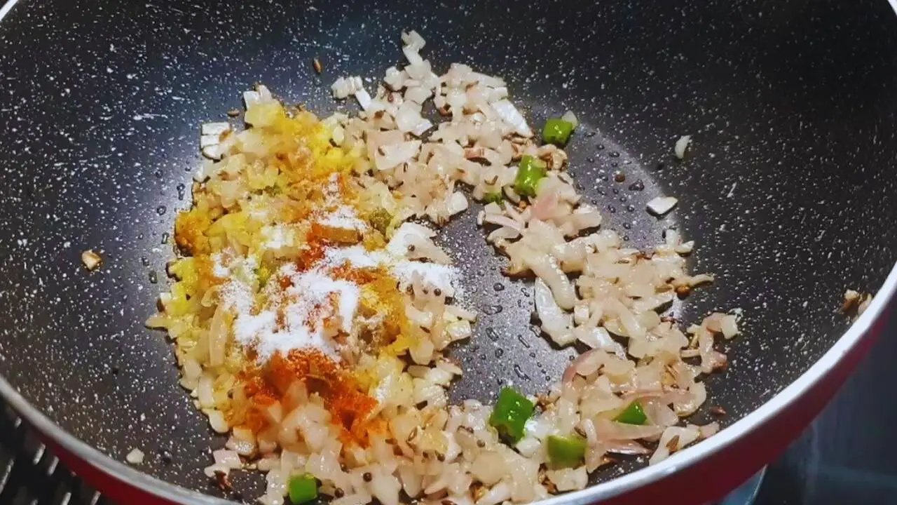 Poha recipe step 5 Adding powdered spices
