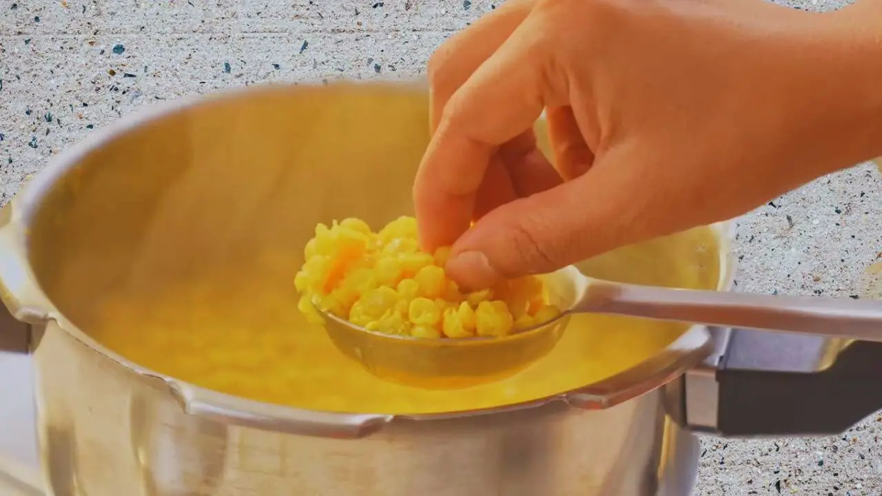 Dal puri recipe step 3 Checking doneness of chana dal