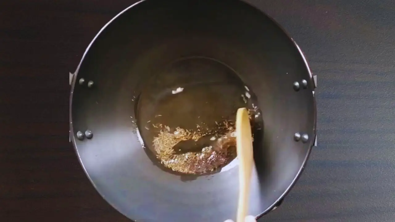 Masala bhat recipe step 4 Frying cumin and mustard seeds