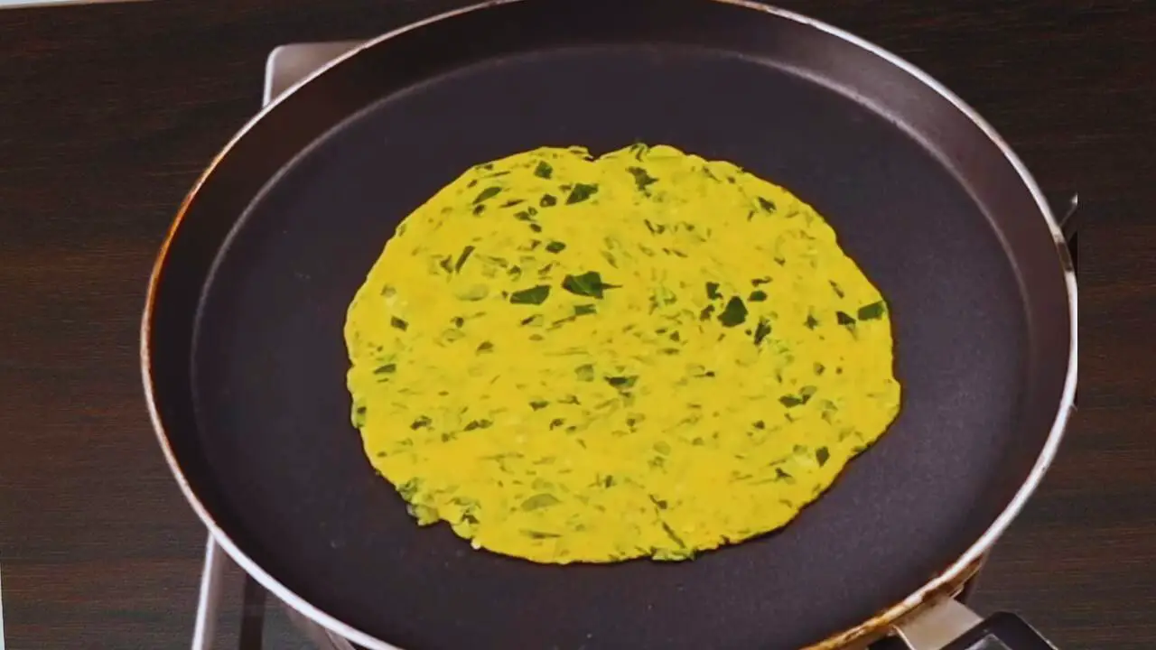 Frying Methi Paratha 