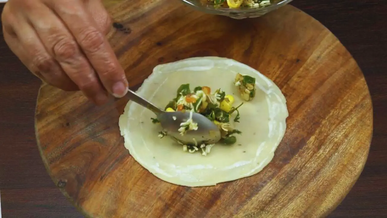 Putting cheese stuffing 