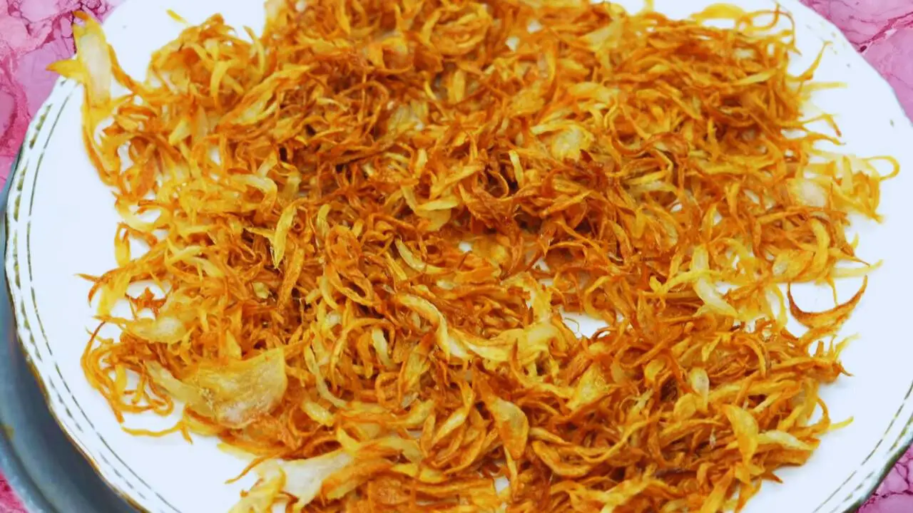 Mutton korma recipe step 2 Removing and cooling fried onions