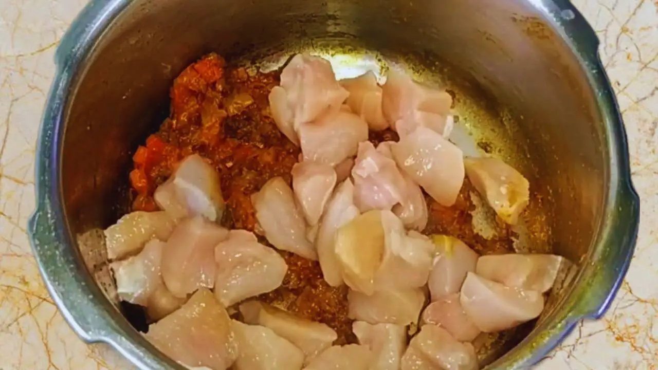 Chicken khichdi recipe step 9 Adding chicken pieces
