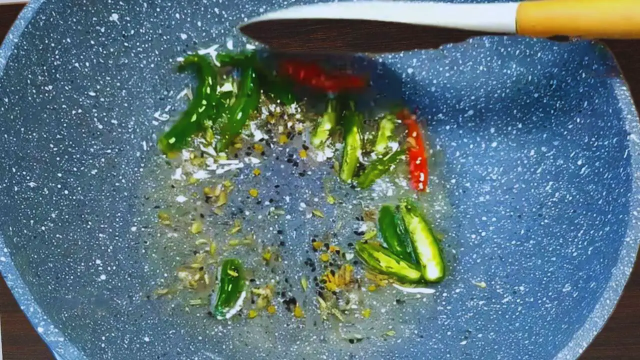 Adding green chilies