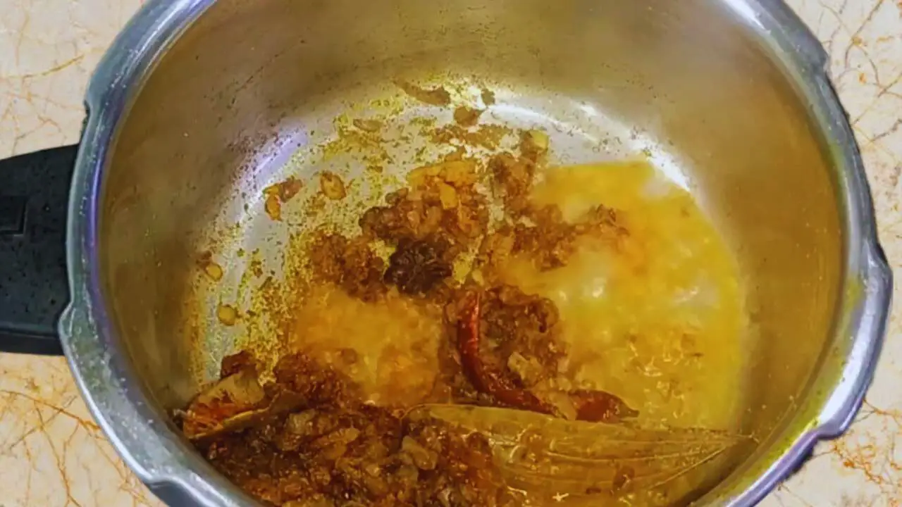 Chicken khichdi recipe step 7 Adding water to spices