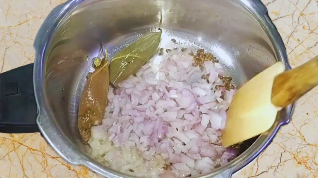 Chicken khichdi recipe step 4 Frying onions