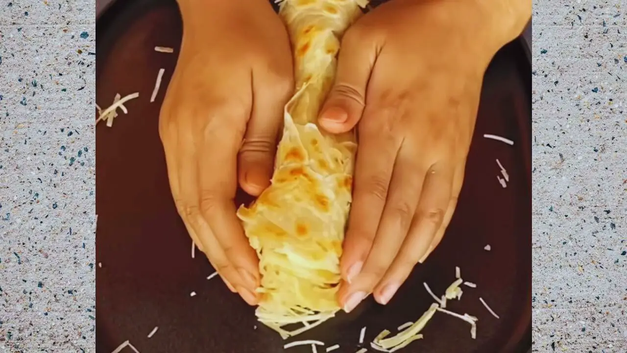 Lachha paratha recipe step 14 Pressing the hot parathas